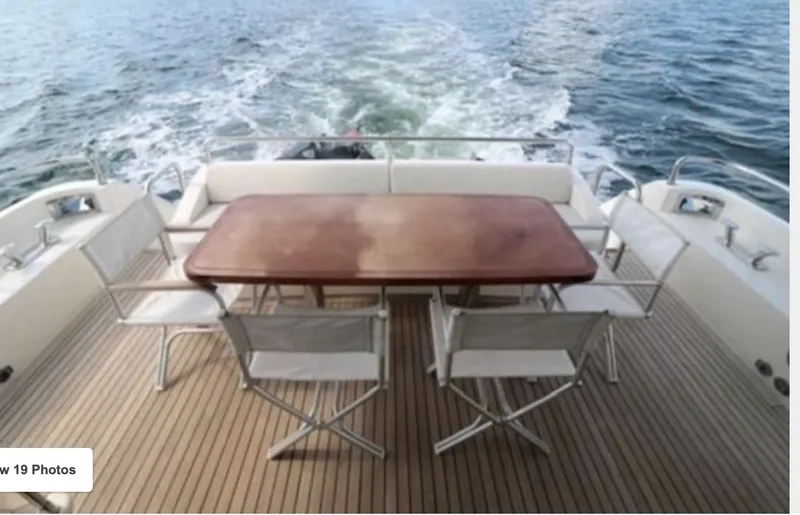 Slide: The Image of Uniesse 65 MY 2009 yacht with deck furniture on the water. - 3