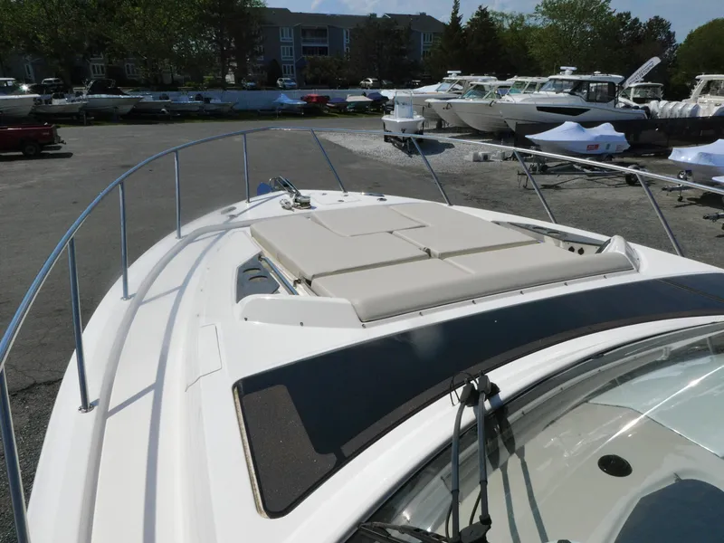 Slide: The Image of 2021 Boston Whaler 405 Conquest boat deck with sunpad, docked in marina. - 27