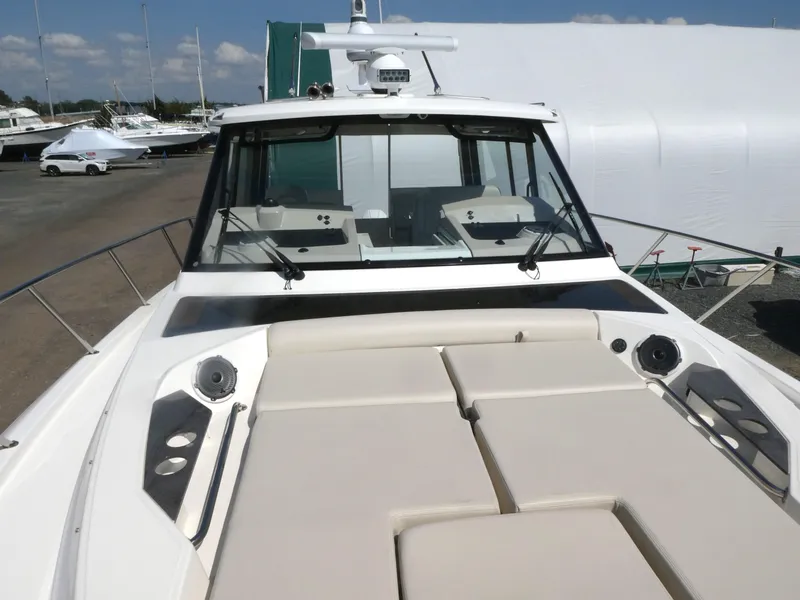 Slide: The Image of 2021 Boston Whaler 405 Conquest boat with spacious deck and modern design. - 28