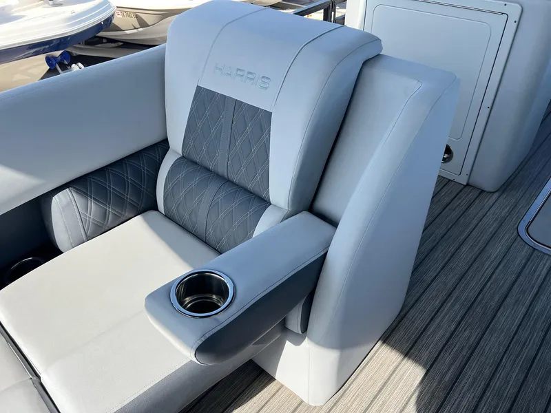 Slide: The Image of Luxury seating on 2021 Harris FloteBote 230 Solstice pontoon boat with cup holder. - 14