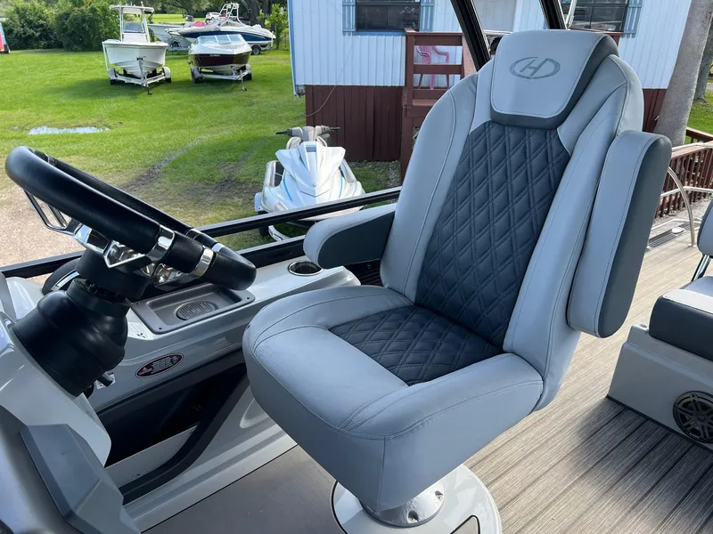Slide: The Image of Captain's chair on 2021 Harris FloteBote 230 Solstice pontoon boat, featuring sleek design and comfort. - 17