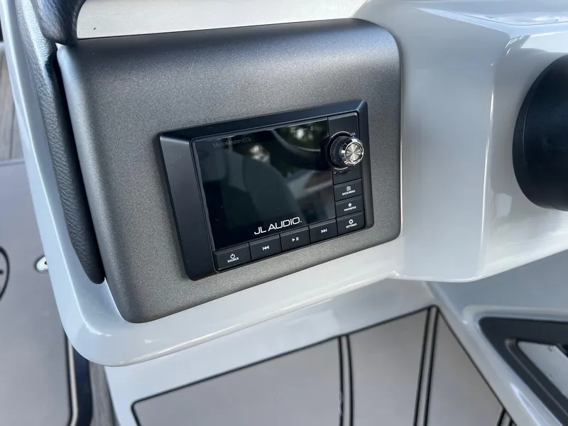 Slide: The Image of JL Audio system on 2021 Harris FloteBote 230 Solstice boat dashboard. - 20
