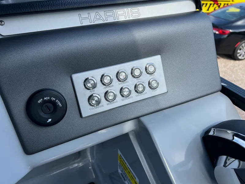 Slide: The Image of Control panel of 2021 Harris FloteBote 230 Solstice boat with labeled buttons. - 21
