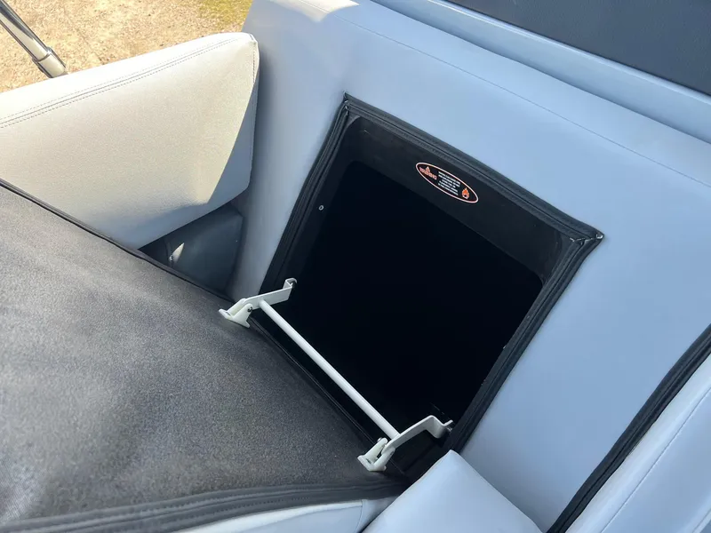 Slide: The Image of 2021 Harris FloteBote 230 Solstice boat seat storage compartment, open and accessible. - 26