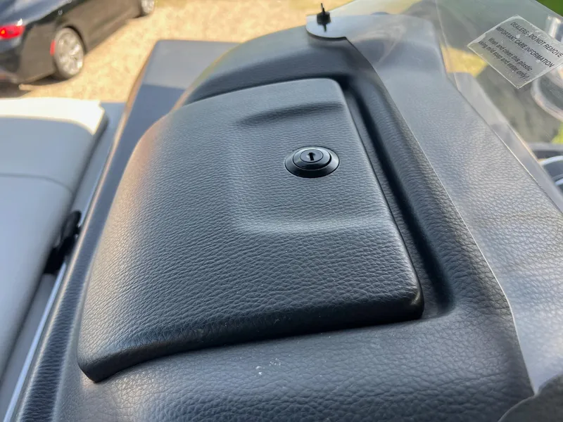 Slide: The Image of Dashboard of 2021 Harris FloteBote 230 Solstice with lockable compartment. - 31