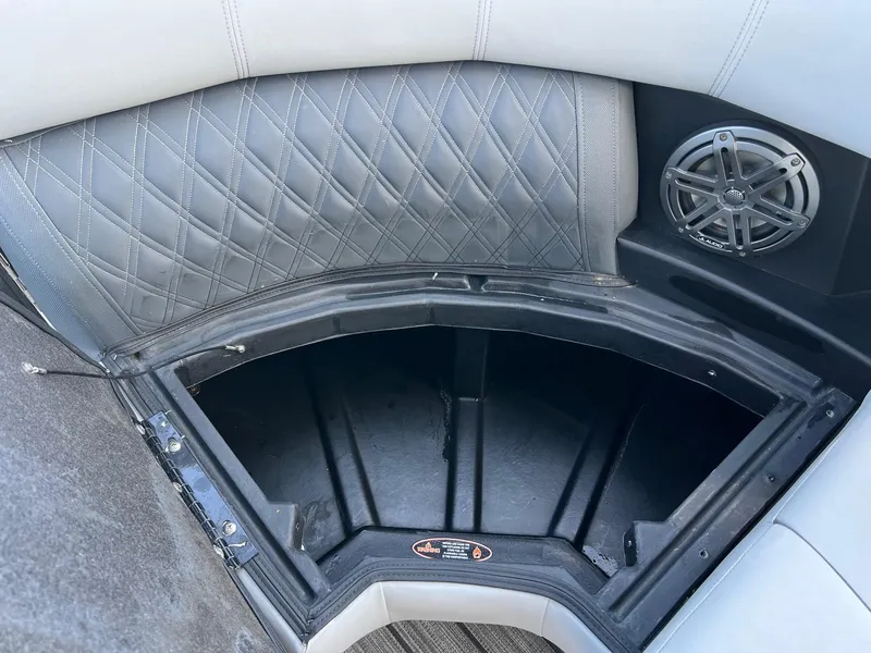 Slide: The Image of Interior storage compartment of 2021 Harris FloteBote 230 Solstice with speaker and quilted upholstery. - 32