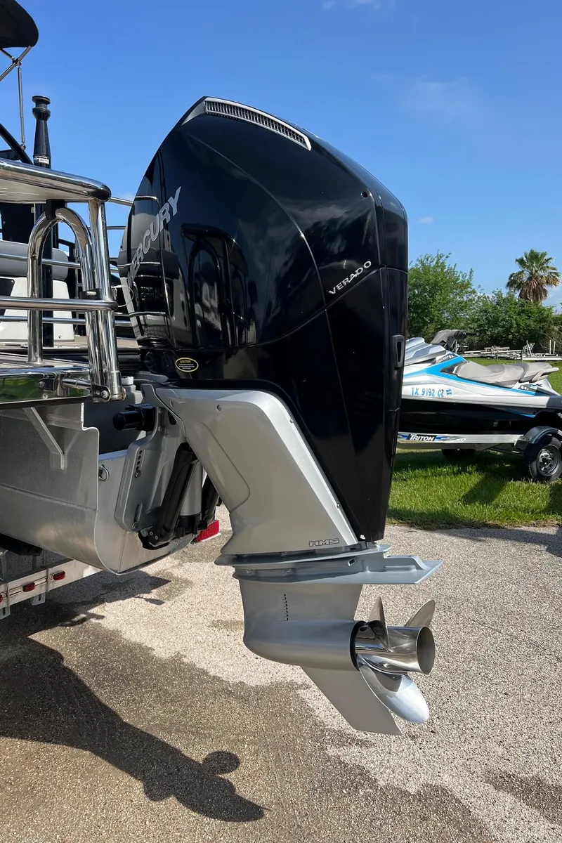 Slide: The Image of 2021 Harris FloteBote 230 Solstice with Mercury outboard engine, parked outdoors. - 34