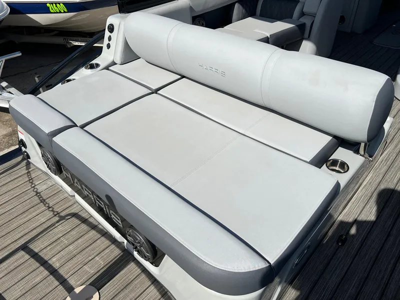 Slide: The Image of 2021 Harris FloteBote 230 Solstice boat with spacious, cushioned seating area. - 6