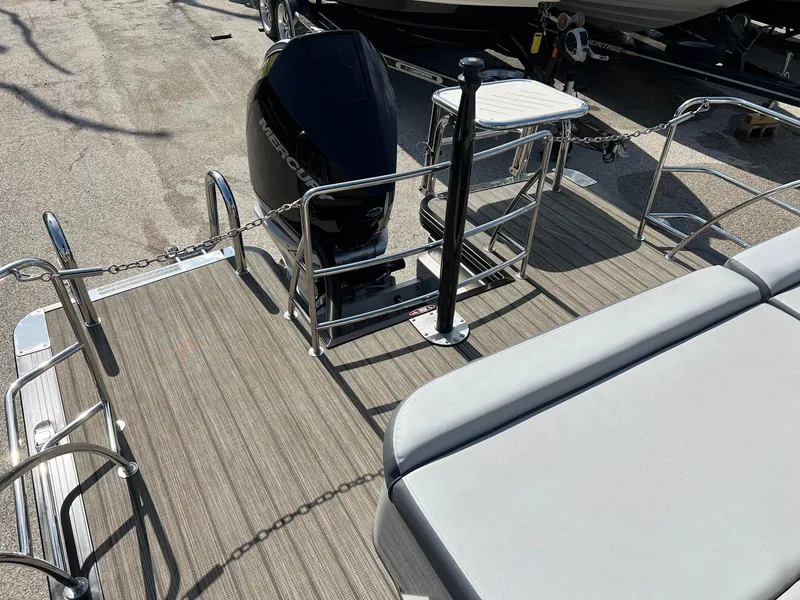 Slide: The Image of 2021 Harris FloteBote 230 Solstice pontoon boat with outboard motor and seating area. - 7