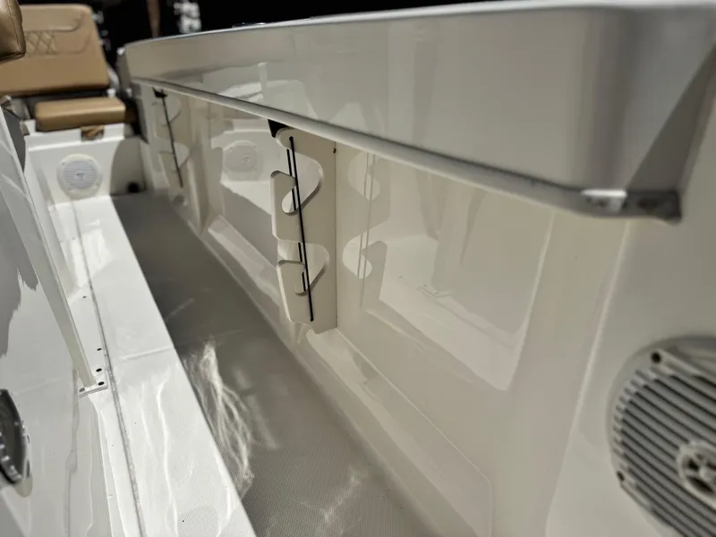 Slide: The Image of 2023 Bayliner Trophy T20CC boat interior with rod holders and seating. - 11