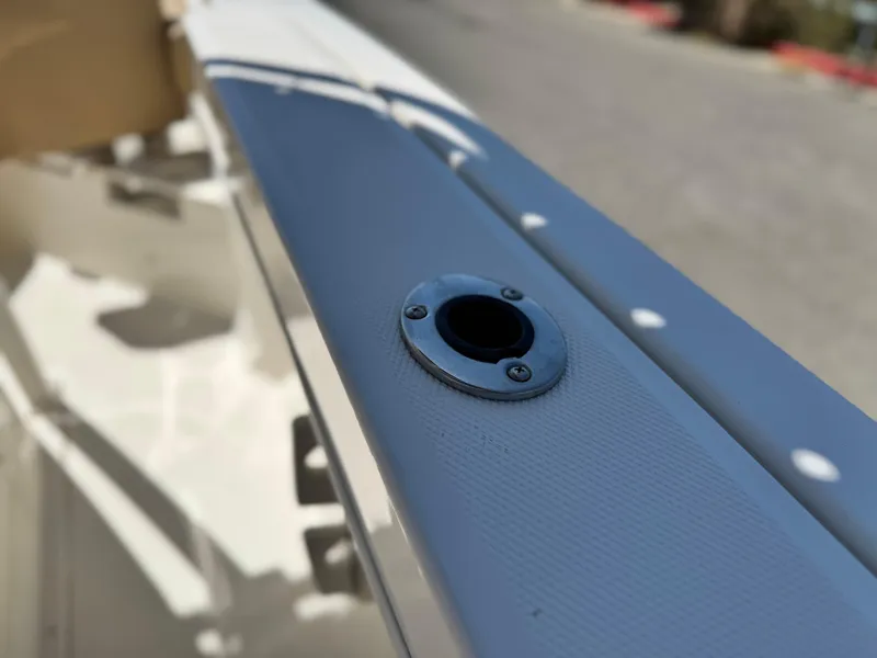 Slide: The Image of 2023 Bayliner Trophy T20CC boat detail showing a rod holder on the deck. - 14