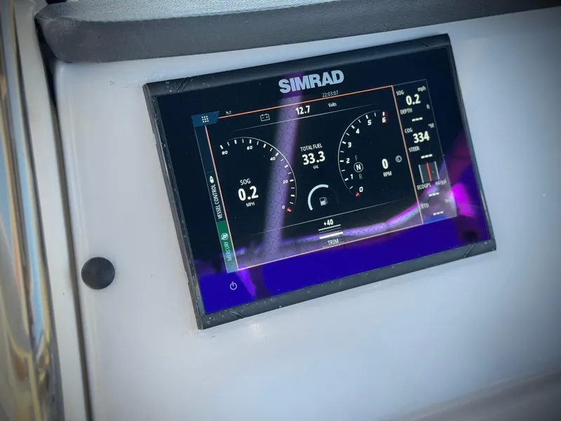 Slide: The Image of Simrad display on 2023 Bayliner Trophy T20CC boat dashboard. - 23