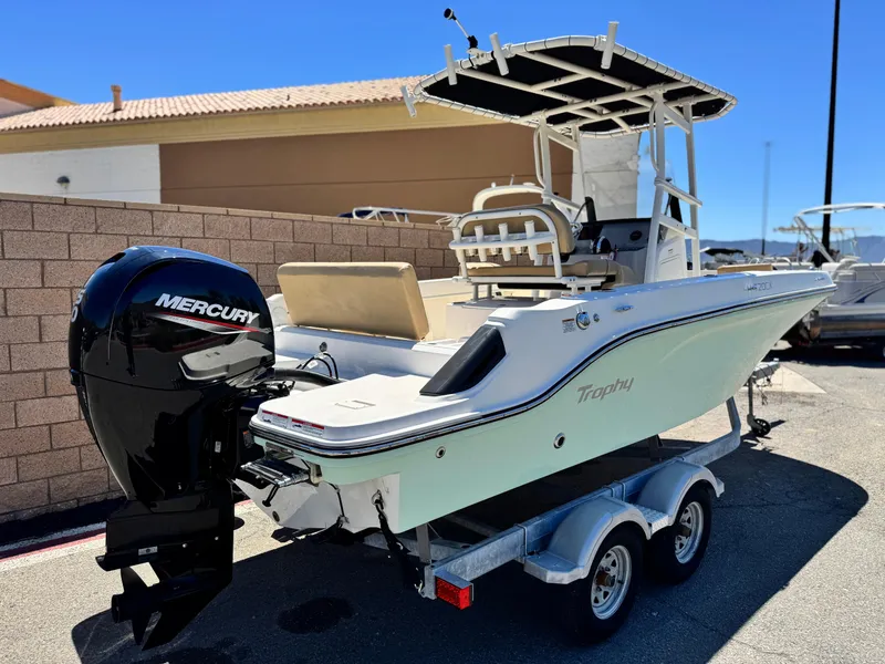 Slide: The Image of 2023 Bayliner Trophy T20CC boat on trailer with Mercury outboard motor. - 5
