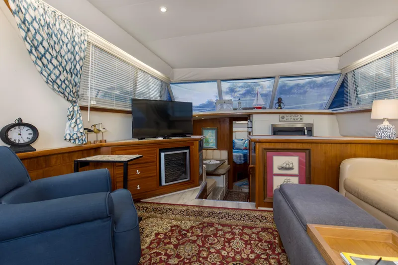 Slide: The Image of Interior of 1997 Carver 445 Aft Cabin Motor Yacht with cozy seating and elegant decor. - 3