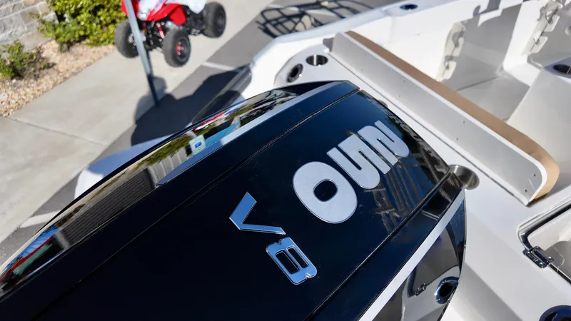 Slide: The Image of 2025 Bayliner Trophy 24 CC boat with V8 engine, outdoor display. - 5