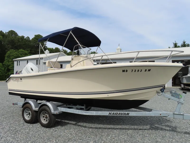 Slide: The Image of 2001 KenCraft Challenger 206 boat on trailer with canopy, parked outdoors. - 0