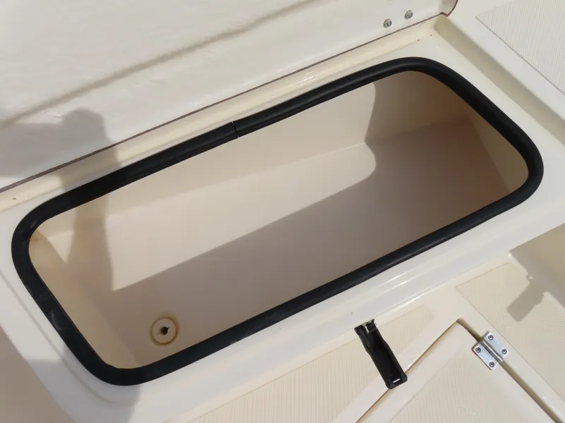 Slide: The Image of Open storage compartment on a 2001 KenCraft Challenger 206 boat. - 10