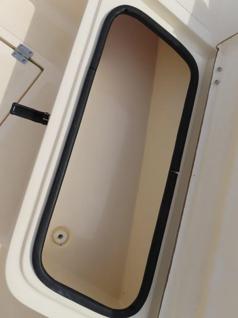 Slide: The Image of Open storage compartment on 2001 KenCraft Challenger 206 boat. - 11