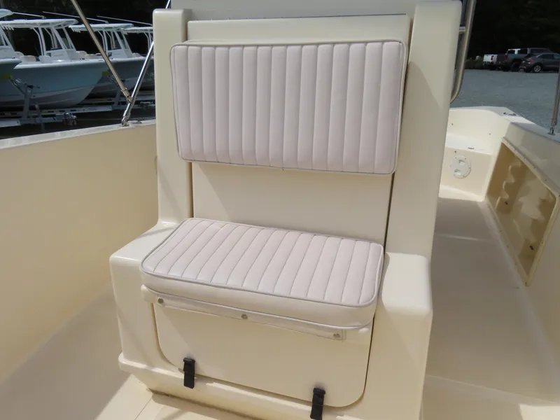Slide: The Image of 2001 KenCraft Challenger 206 boat seat with cushioned backrest and storage. - 18