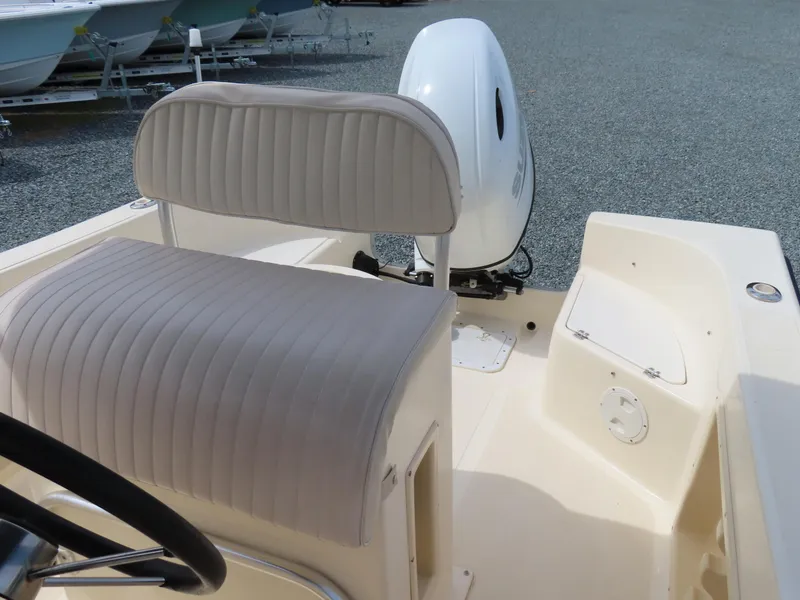 Slide: The Image of 2001 KenCraft Challenger 206 boat interior with cushioned seating and outboard motor. - 20