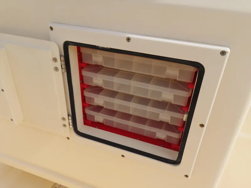 Slide: The Image of Storage compartment with tackle boxes on a 2001 KenCraft Challenger 206 boat. - 26