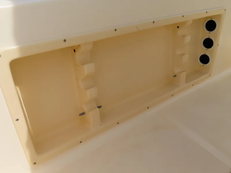 Slide: The Image of KenCraft Challenger 206 boat storage compartment, 2001 model, featuring three circular openings. - 30