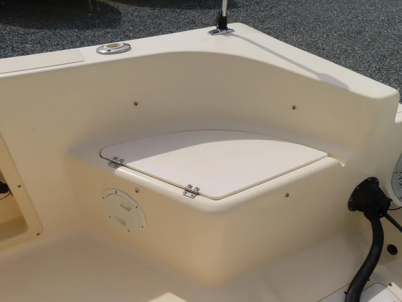Slide: The Image of 2001 KenCraft Challenger 206 boat interior, featuring a storage compartment and clean design. - 31