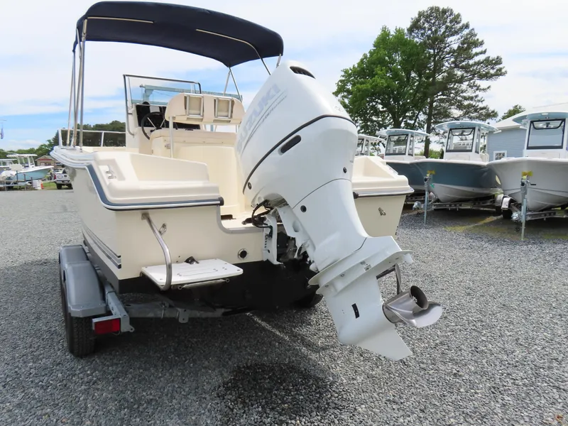 Slide: The Image of 2001 KenCraft Challenger 206 boat with outboard motor on trailer, parked on gravel. - 5
