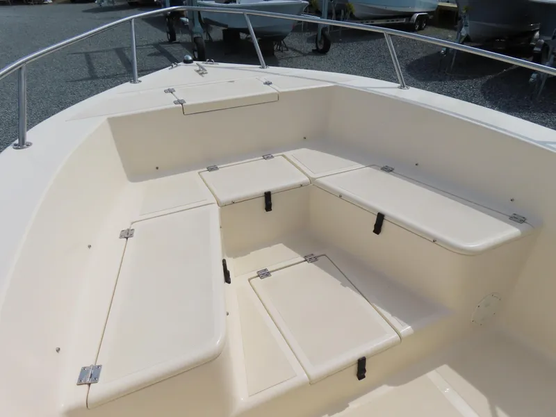 Slide: The Image of 2001 KenCraft Challenger 206 boat interior with cushioned seating and storage compartments. - 6