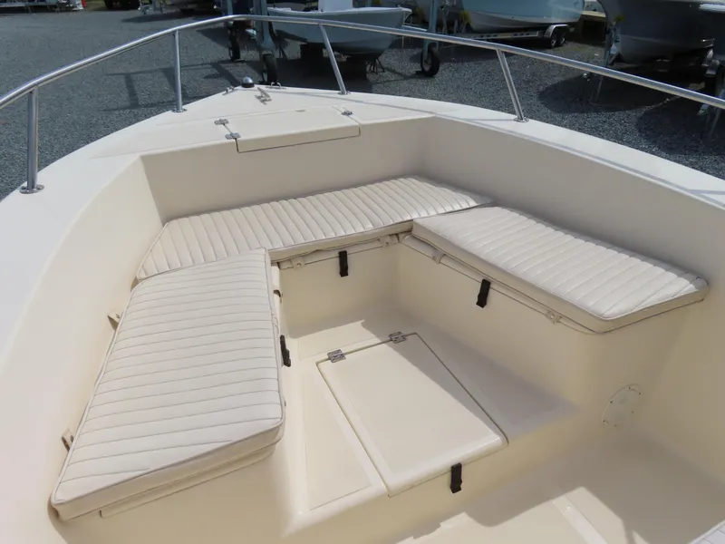 Slide: The Image of 2001 KenCraft Challenger 206 boat interior with cushioned seating and storage compartments. - 7