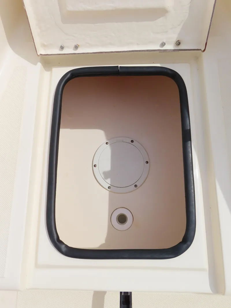 Slide: The Image of Open storage compartment on a 2001 KenCraft Challenger 206 boat. - 9