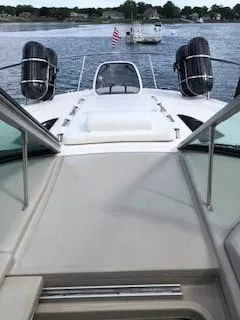 Slide: The Image of 2007 Sea Ray 310 Sundancer on water, view from deck, American flag visible. - 16