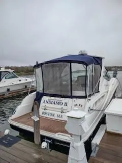 Slide: The Image of 2007 Sea Ray 310 Sundancer docked in Boston, MA, with covered cockpit. - 3
