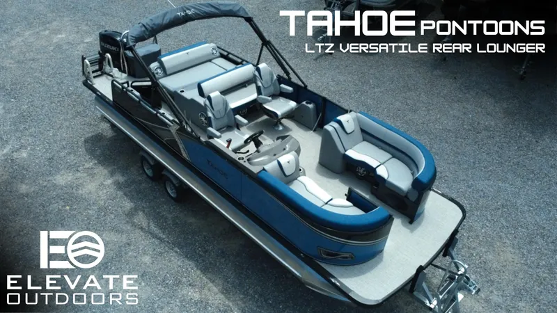 Slide: The Image of 2025 Tahoe Pontoon LTZ Versatile Rear Lounger, blue exterior, elevated outdoor setting. - 0
