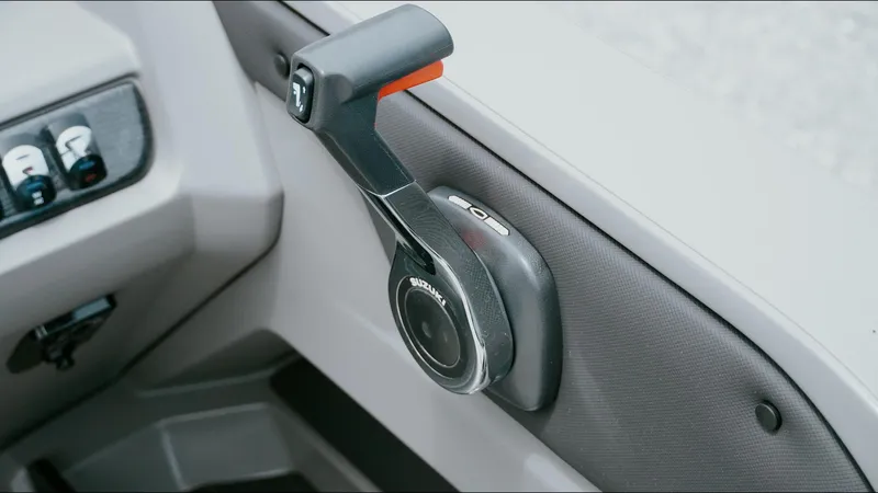 Slide: The Image of Throttle control of 2025 Tahoe Pontoon LTZ Versatile Rear Lounger boat. - 16