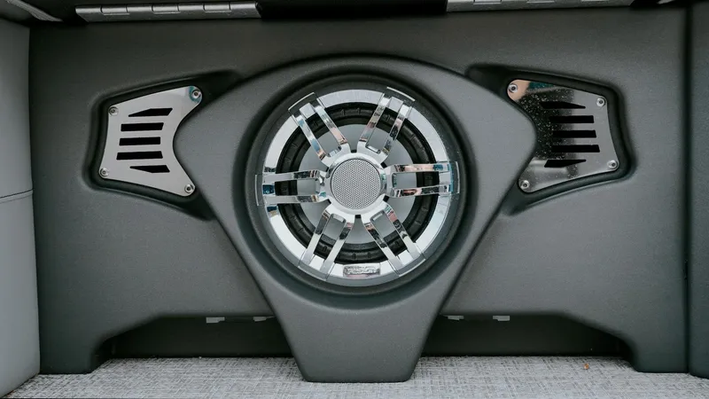 Slide: The Image of 2025 Tahoe Pontoon LTZ Versatile Rear Lounger speaker system, featuring a central subwoofer and side vents. - 20