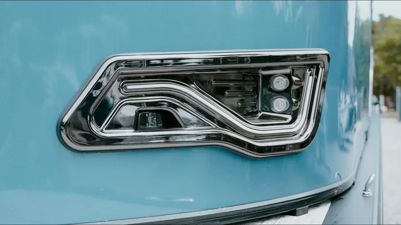 Slide: The Image of 2025 Tahoe Pontoon LTZ Versatile Rear Lounger, sleek blue exterior with modern chrome detailing. - 21