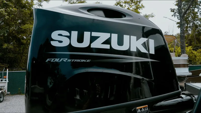 Slide: The Image of Suzuki four-stroke engine on 2025 Tahoe Pontoon LTZ Versatile Rear Lounger. - 5