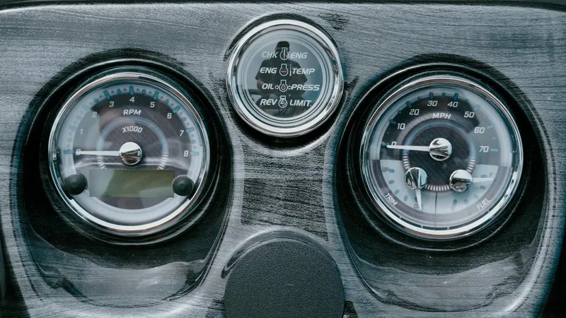 Slide: The Image of Dashboard of 2025 Tahoe Pontoon LTZ Versatile Rear Lounger with gauges and indicators. - 6