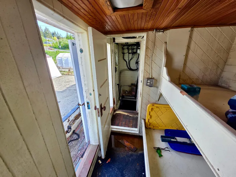 Slide: The Image of Interior of a vintage 1890 custom tugboat with wooden ceiling and bunk beds. - 12
