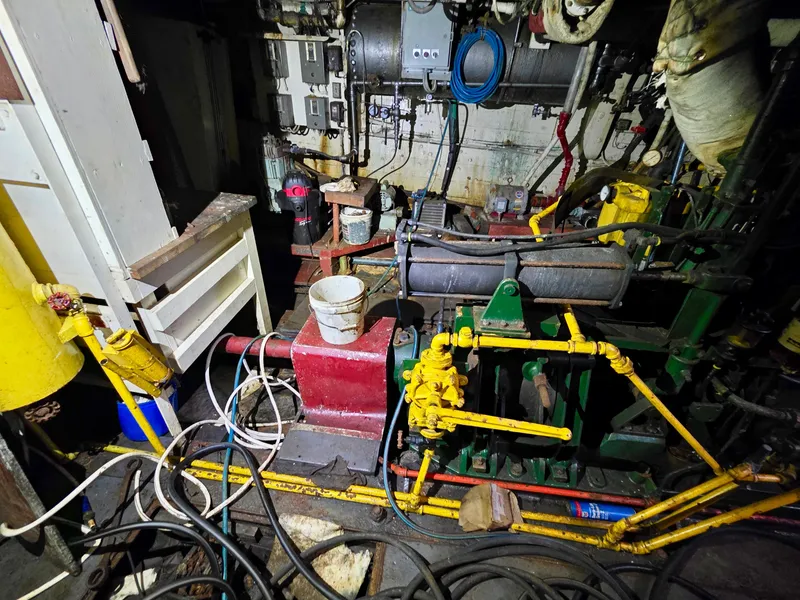 Slide: The Image of Engine room of a vintage 1890 custom tugboat with machinery and cables. - 31