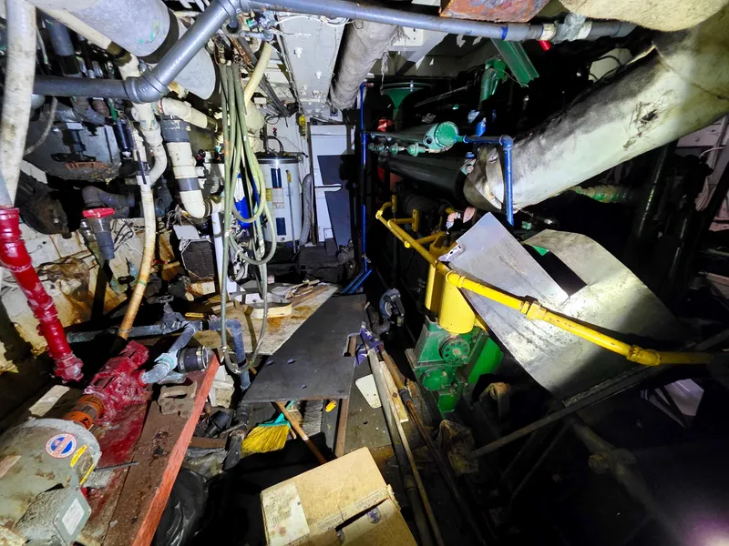 Slide: The Image of Engine room of a vintage 1890 custom tugboat, showcasing pipes and machinery. - 34