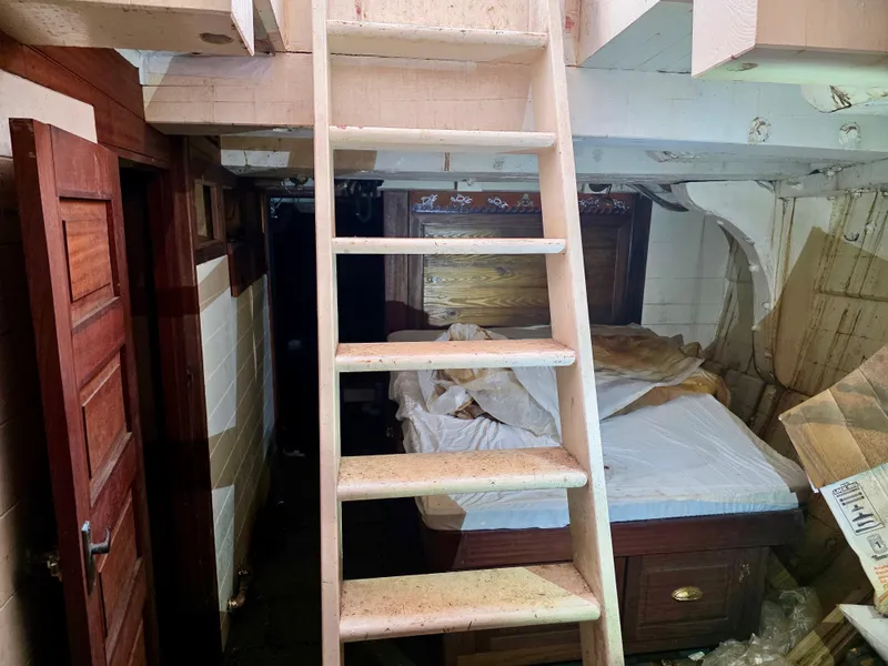 Slide: The Image of Interior of an 1890 custom tugboat with wooden ladder and bed. - 36