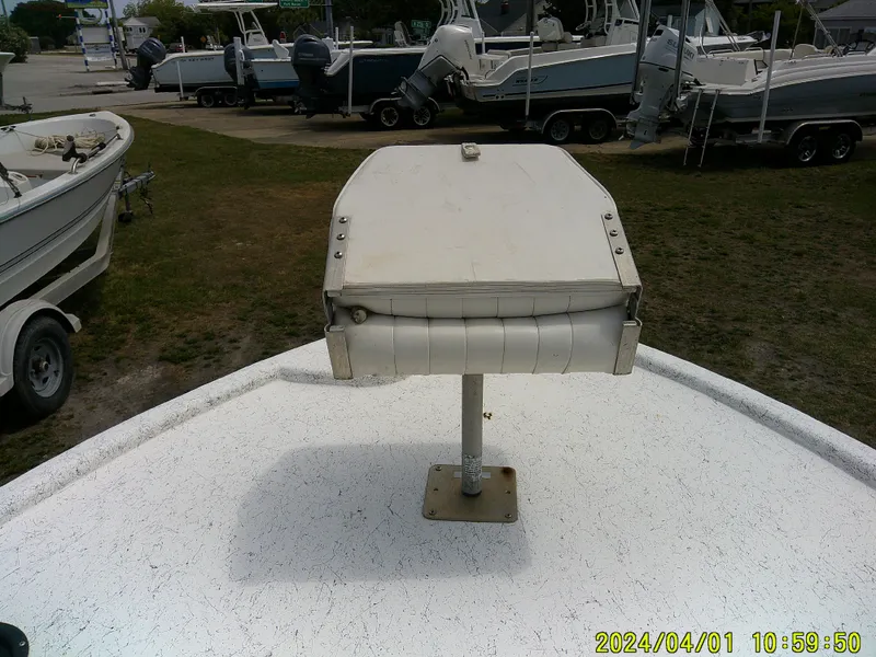 Slide: The Image of Boat seat on a Mako 1901, 2008 model, in a marina setting. - 10