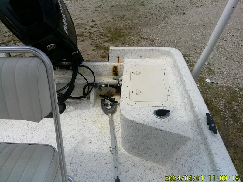 Slide: The Image of Boat interior with seating, engine, and storage compartment; Mako 1901 model, 2008. - 15