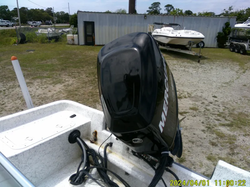 Slide: The Image of Boat with Mercury outboard motor in a yard, Mako 1901 model, 2008. - 16