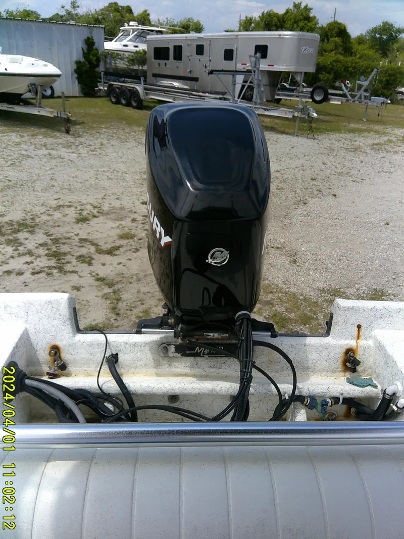 Slide: The Image of Mako 1901 boat with Mercury outboard motor, parked outdoors, 2008 model. - 20