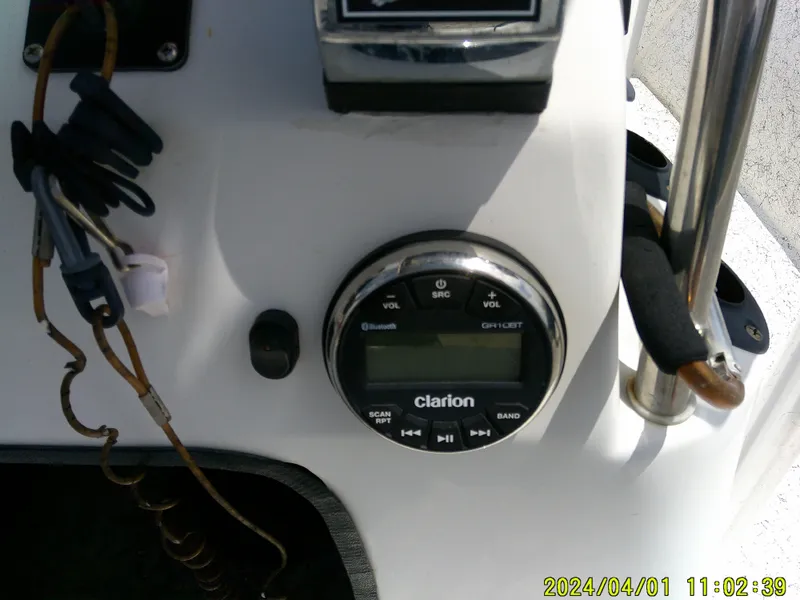 Slide: The Image of Boat dashboard with Clarion audio system, Mako 1901 model, 2008, showing date and time. - 22