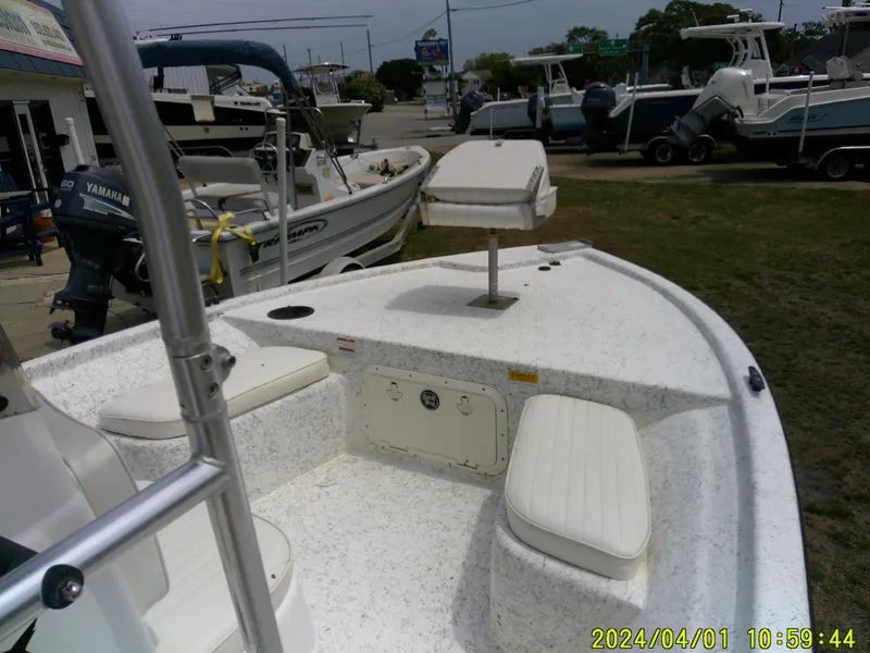 Slide: The Image of Boat interior with seating, Mako 1901 model, 2008, in a marina setting. - 9