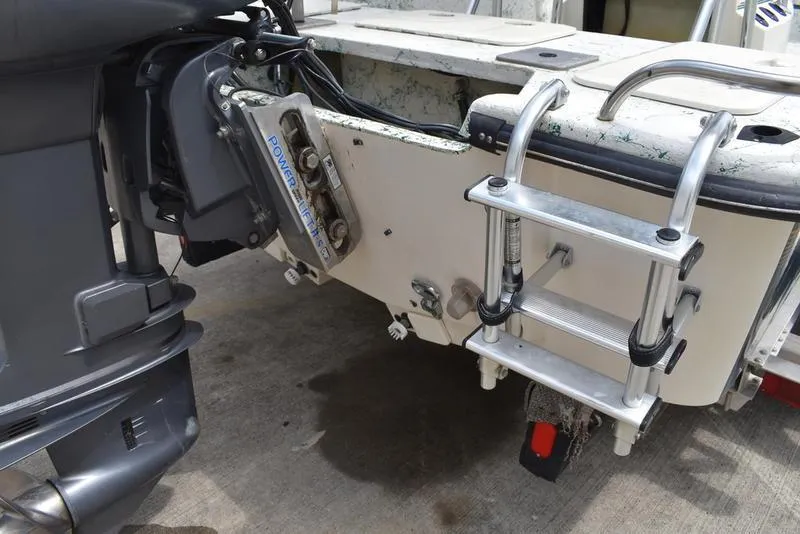 Slide: The Image of 1998 Kenner 21V CC Tunnel boat with motor and ladder detail. - 10